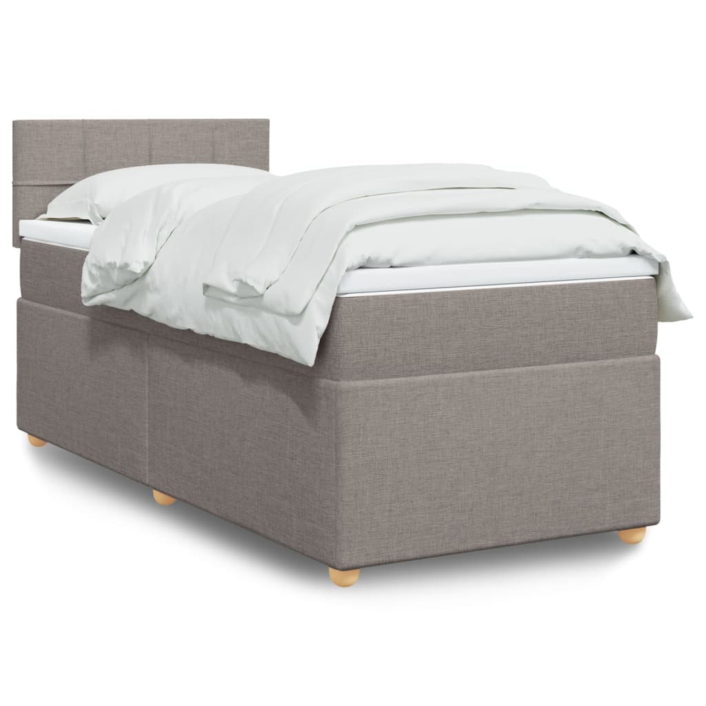 Taupekleurige boxspring van 200x200 cm met pocketveringmatrassen, topmatras en gestoffeerd hoofdbord