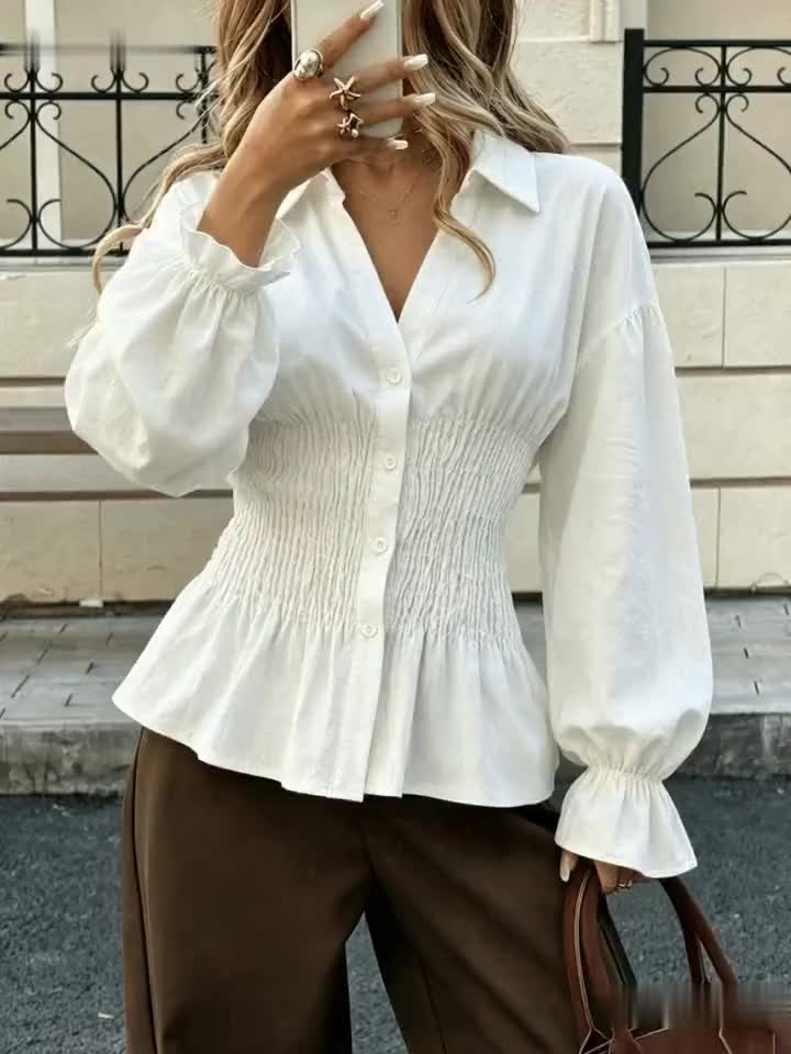 Elegante damesblouse met pofmouwen en getailleerde pasvorm