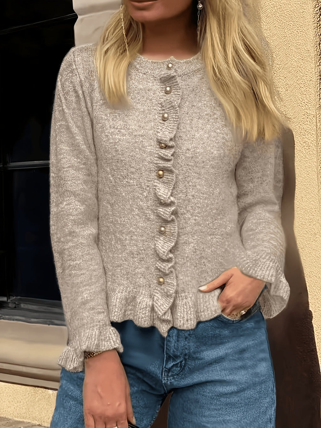 Damesvest met elegante parelknopen