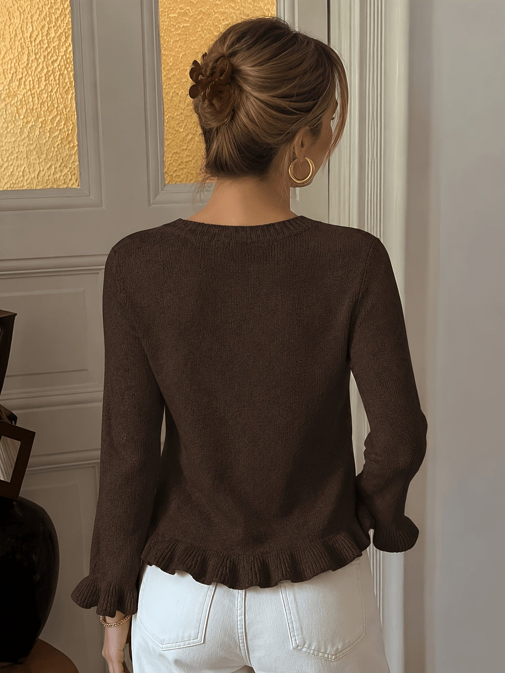Damesvest met elegante parelknopen