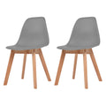Set van vier turquoise Scandinavische eetkamerstoelen met ergonomische kunststof kuipzitting en houten poten