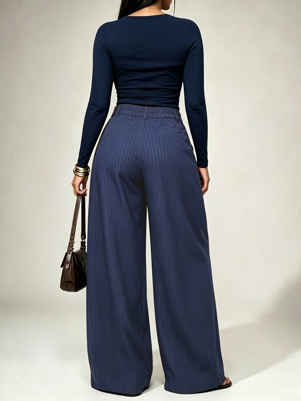 Gestreepte damesbroek met high-waist taille en wijde pijpen