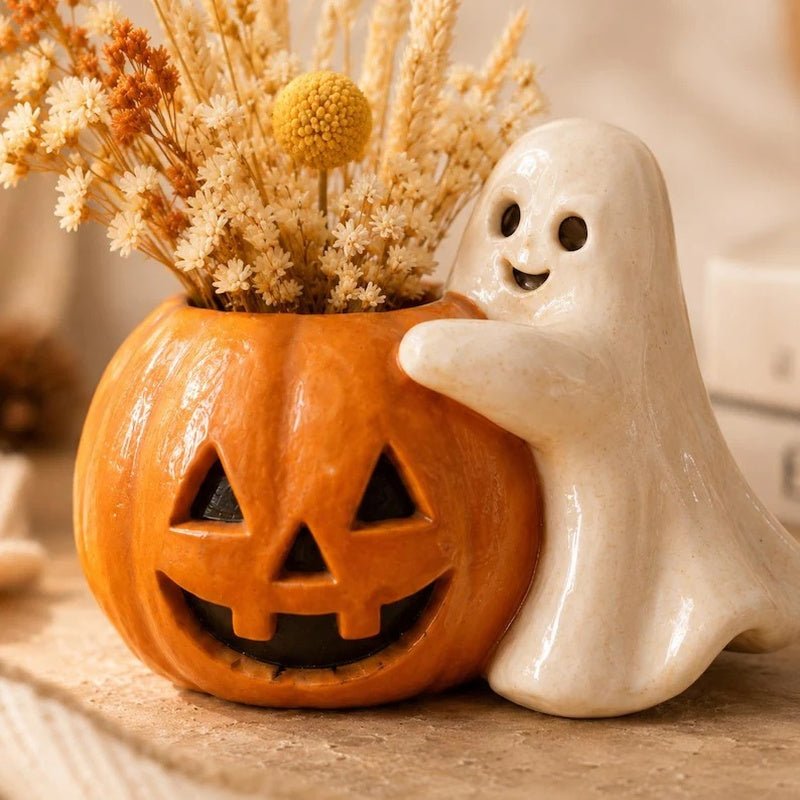 Halloween pompoen bloempot met spookdecoratie