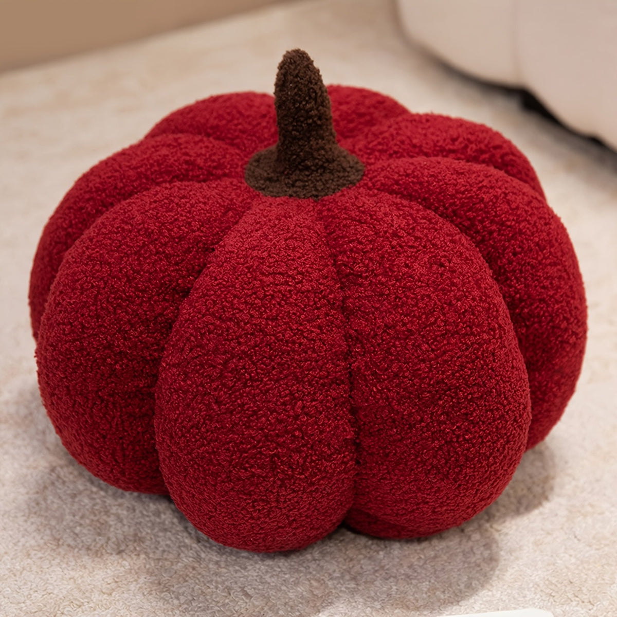 Pompoen kussen als herfstdecoratie